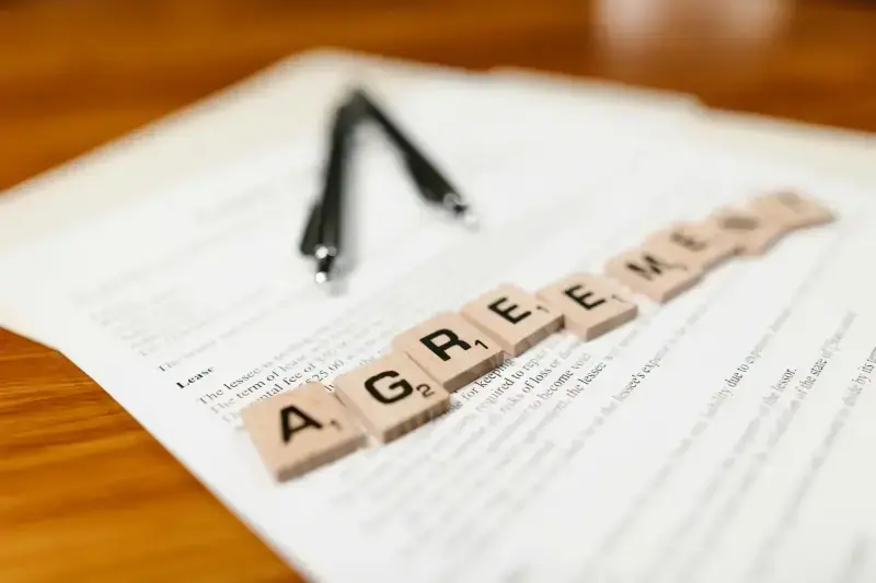 Agreement document with pen ready to sign
