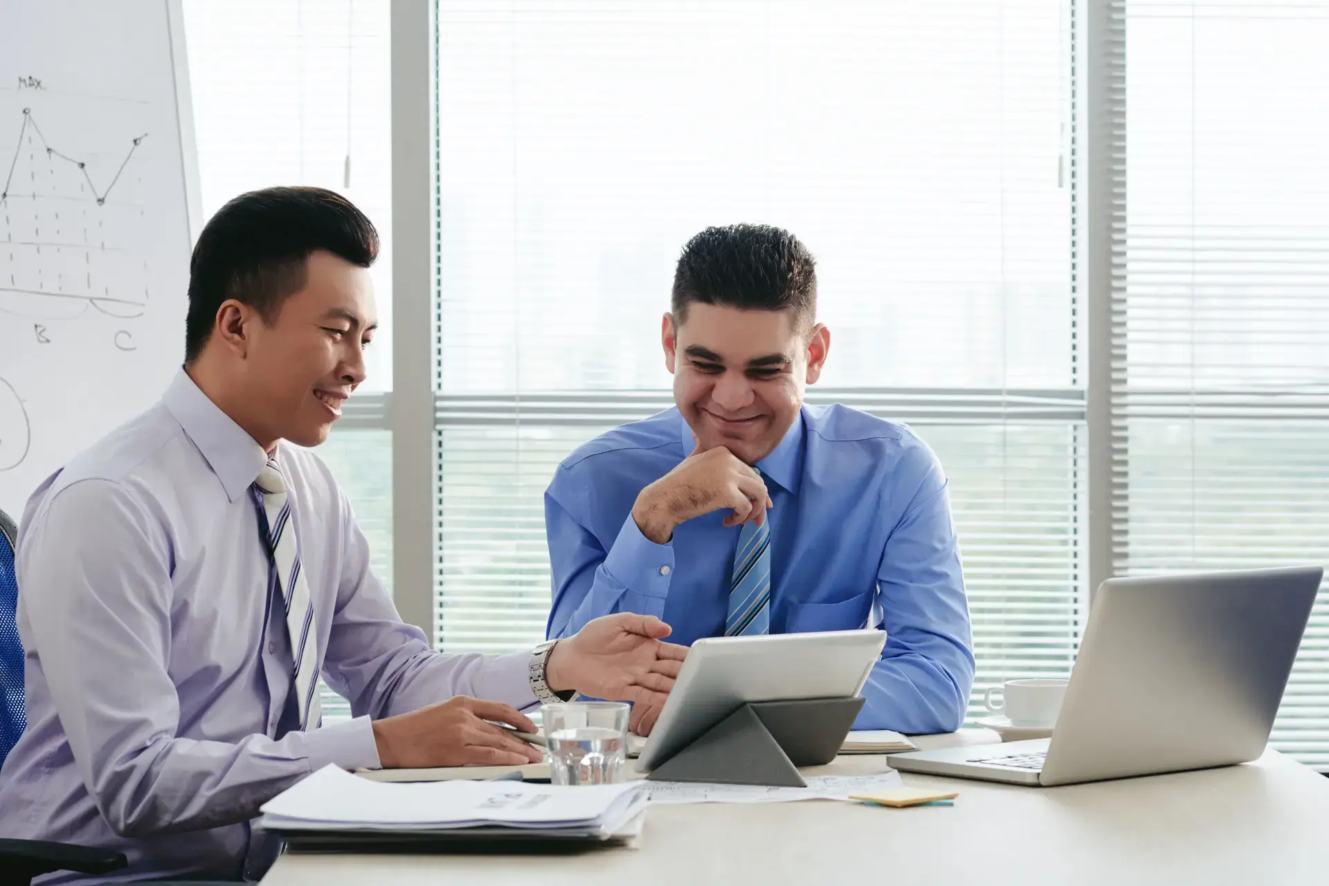 Financial advisors planning mutual fund investment strategy with clients