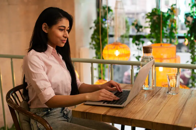 Investor calmly checking her SIP portfolio on a laptop
